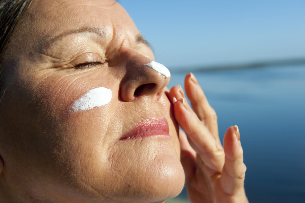 Portrait,Of,Attractive,Mature,Woman,With,Suncream,On,Her,Face